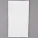 A white paper towel with a gray border.