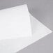 A close-up of white Heavy Duty Dry Wax Paper.