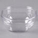 A clear plastic Dinex square bowl.