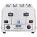 A silver Waring 4-slice commercial toaster with black knobs and buttons.
