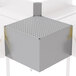 A stainless steel metal box with holes in it.