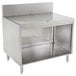 An Advance Tabco stainless steel drainboard cabinet with a shelf.