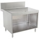 A stainless steel Advance Tabco Prestige Series drainboard cabinet with a shelf.