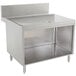 An Advance Tabco stainless steel drainboard cabinet with a shelf.