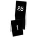A stack of black Cal-Mil table tents with white numbers on them.