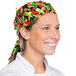 A woman wearing an Intedge multi pepper patterned chef bandana.