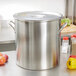 a large silver pot on a counter