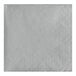 A white napkin with a diamond pattern.