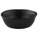 An Elite Global Solutions black melamine bowl on a table with a white background.
