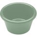 A close-up of a hemlock green Elite Global Solutions melamine ramekin.