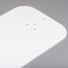 A white rectangular plastic sign with holes that reads "Por Favor Tome Su Numero"