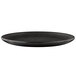 An Elite Global Solutions black melamine plate with a rim.