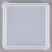 A clear lid on a white square plastic container.