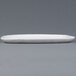 A white rectangular Elite Global Solutions melamine plate with an irregular edge.