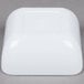 A white square GET Melamine Bowl on a gray surface.