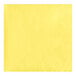 A yellow napkin with a diamond pattern.