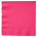 A hot magenta pink Creative Converting paper dinner napkin with a white background.
