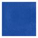 A blue napkin with a diamond pattern on a white surface.