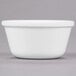 A close up of a white Carlisle ramekin.