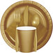 A close-up of a Creative Converting Glittering Gold luncheon napkin on a white background.