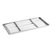 A Beverage-Air condensate pan assembly with white paper in it.