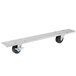 A metal plate with black swivel casters attached on a white background.