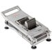 A Nemco Roma Tomato Slicer, a metal device with a metal handle and blades.