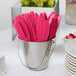 A bucket of Creative Converting Hot Magenta Pink plastic knives.
