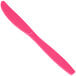 A pink plastic knife with a black handle.