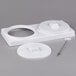 A white plastic object with a round hole.