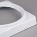 A white plastic ring with a round shape.