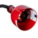 A red Cres Cor infrared bulb with a black cord.