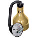 A yellow lamp with a black cord and a round polished brass object with wires.
