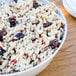 A white melamine bowl filled with pasta.