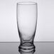 A close-up of a Libbey Atrium cooler glass with a rim on a table.