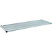 A grey metal MetroMax Q shelf with a white plastic grate with holes.