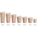 A row of Choice paper hot cups with a brown and white cafe design and text.
