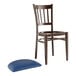 A Lancaster Table & Seating brown metal slat back chair with a detached navy vinyl seat.