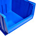 a blue plastic bin with a white background