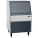 A grey and silver Follett undercounter flake ice machine.