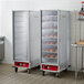 An Avantco full size heated holding cabinet with a clear door holding bread.