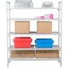 A white Cambro Camshelving® Premium shelving unit with vented shelves holding boxes and plastic containers.