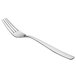 An Arcoroc stainless steel dessert fork with a silver handle.