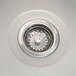 The left sink drain on a Advance Tabco stainless steel 3 compartment pot sink.