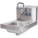 An Advance Tabco stainless steel hand sink with a splash mount faucet.
