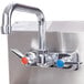 A stainless steel Advance Tabco hand sink with a splash mount faucet.