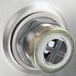 The drain of an Advance Tabco stainless steel hand sink.