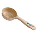 A beige polycarbonate perforated portion spoon with a green handle.