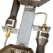 A Cooking Performance Group front main burner pipe assembly with metal parts.