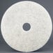 A white circular 3M Natural Blend burnishing floor pad with a hole in the middle.